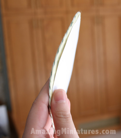 Glue on some cardstock on the back of the adhesive