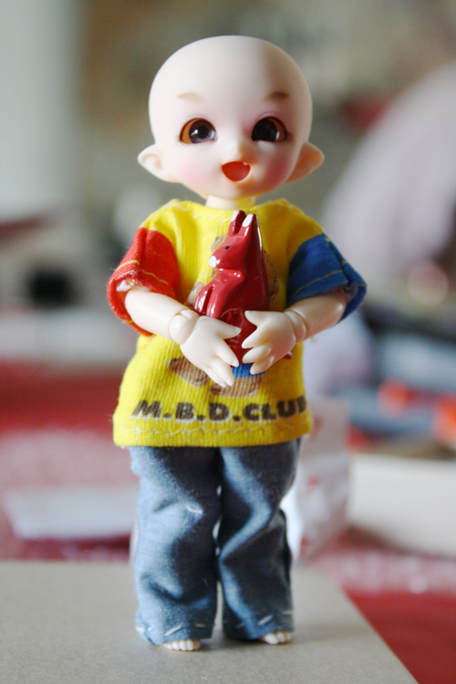 PukiPuki holding a dollhouse miniature kangaroo statue